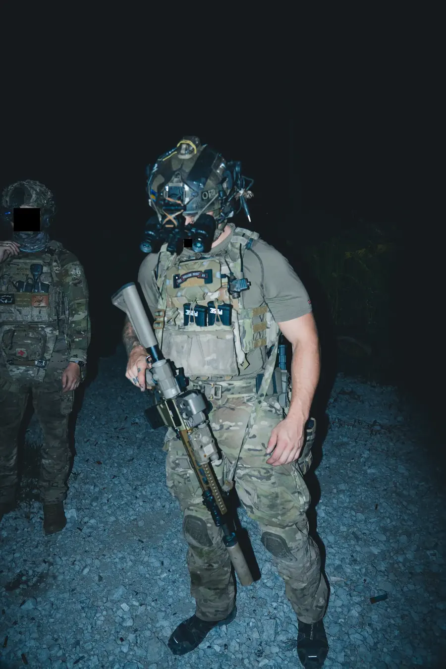 Team moving through a night training environment
