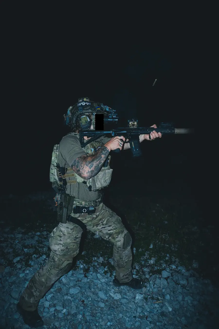 Operator in the field at night wearing Hollowpoint Group apparel