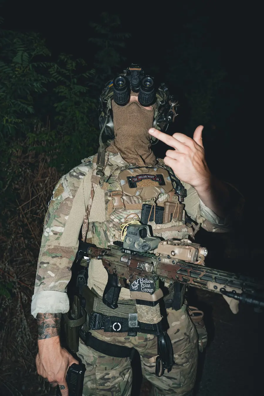 Close detail of Hollowpoint Group patch and equipment on a plate carrier